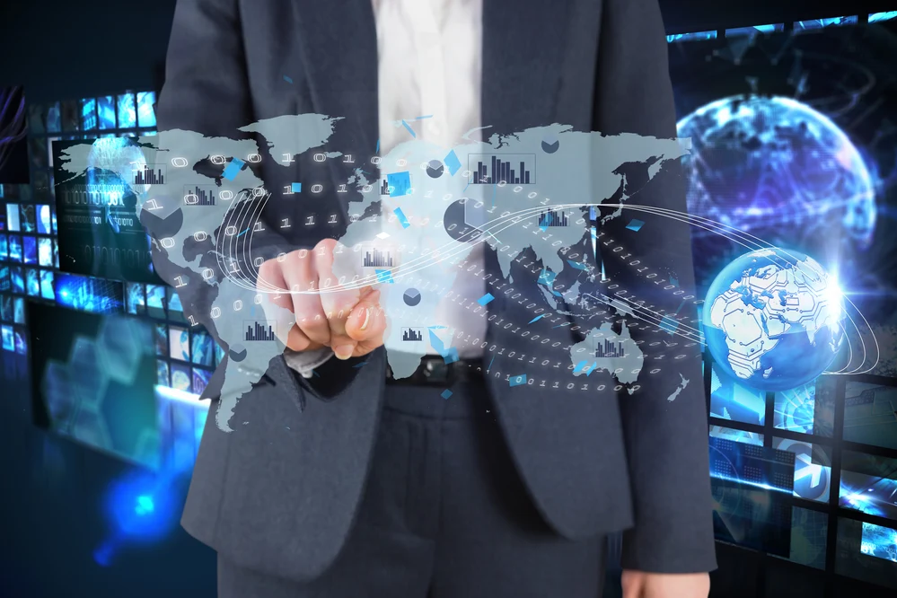 Businessman interacting with virtual world map and global CRM data visualization — ideal for overseas education consultants in Kerala